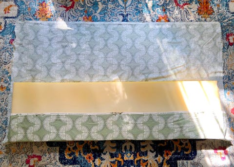 pinning fabric to foam to create a window seat cushion