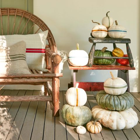 pumpkins decorated with ribbon to look like grain sacks