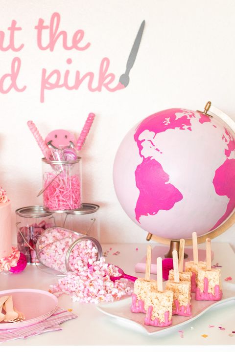 a pinkthemed party, a great baby shower idea, with a pink globe, pink popcorn, pink cereal treats and other pink candies