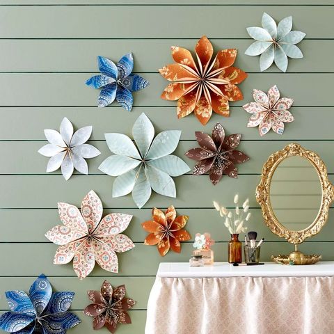 flowers made from wallpaper hanging on wall