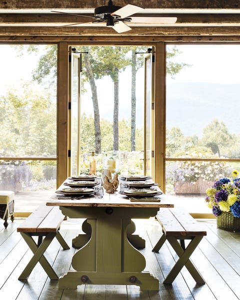 screened in porch with dining table