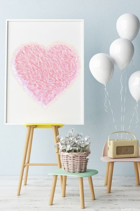 diy valentine gifts, pink fur heart decoration propped on a chair, along with white balloons and a basket of flowers
