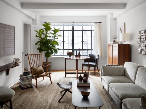 living room, gray sofa, fiddle leaf fig, coffee table, coffee table books, wall art