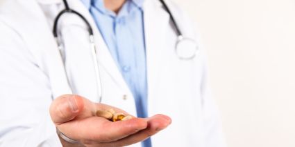 Jenny Vitamin D Doctor Holding Pills