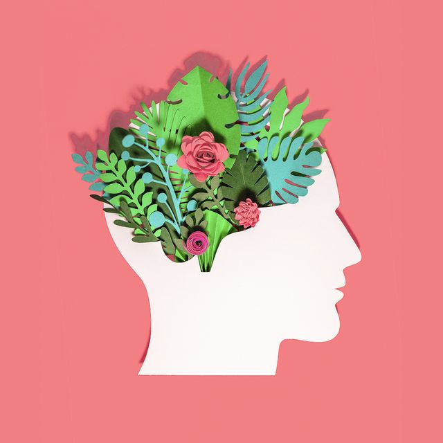 think green, paper craft head made with paper with plants and flowers growing in there on red background