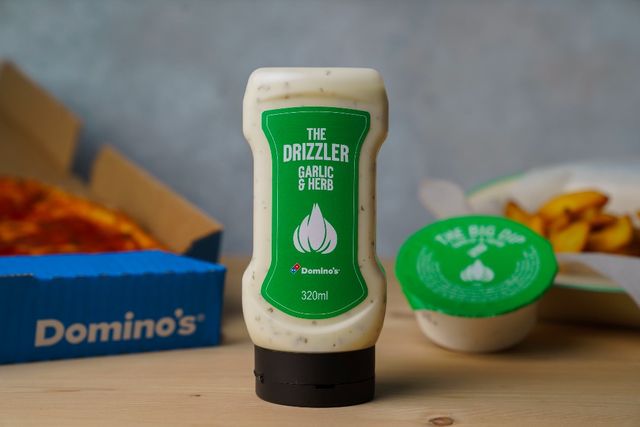 you can now get domino's iconic garlic and herb dip in bottles