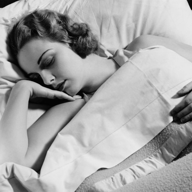 young woman asleep in bed, bw, closeup