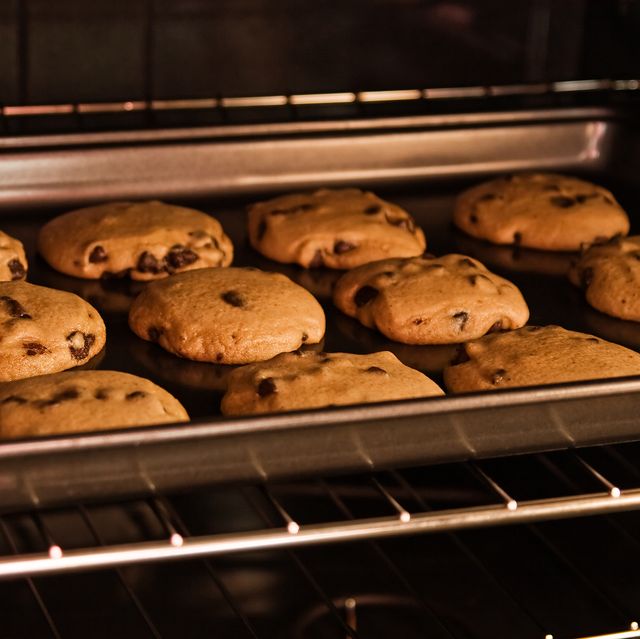 A dozen cookies baking in the oven