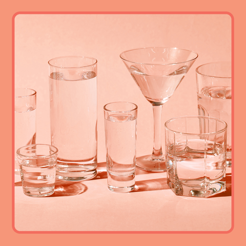 various drinking glasses on peach background