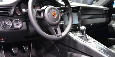 Land vehicle, Vehicle, Car, Steering wheel, Center console, Porsche 911 gt3, Steering part, Luxury vehicle, Gear shift, Automotive design, 