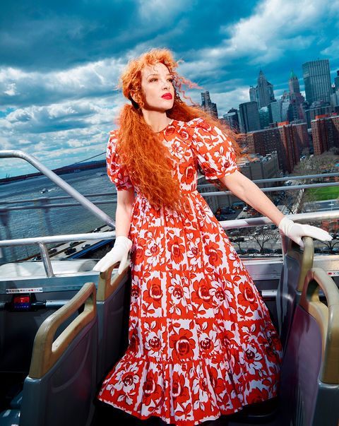 batsheva hay wears a floral print dress in front of the new york city skyline from the batsheva hay x laura ashley second collection