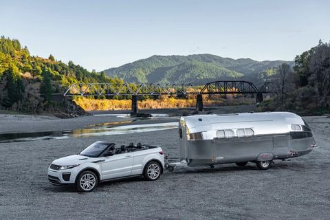 bowlus road chief trailer being towed by a land rover convertible
