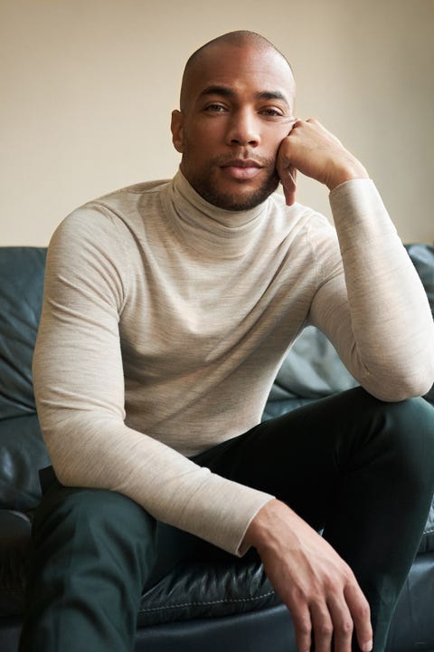 kendrick sampson lounges on sofa