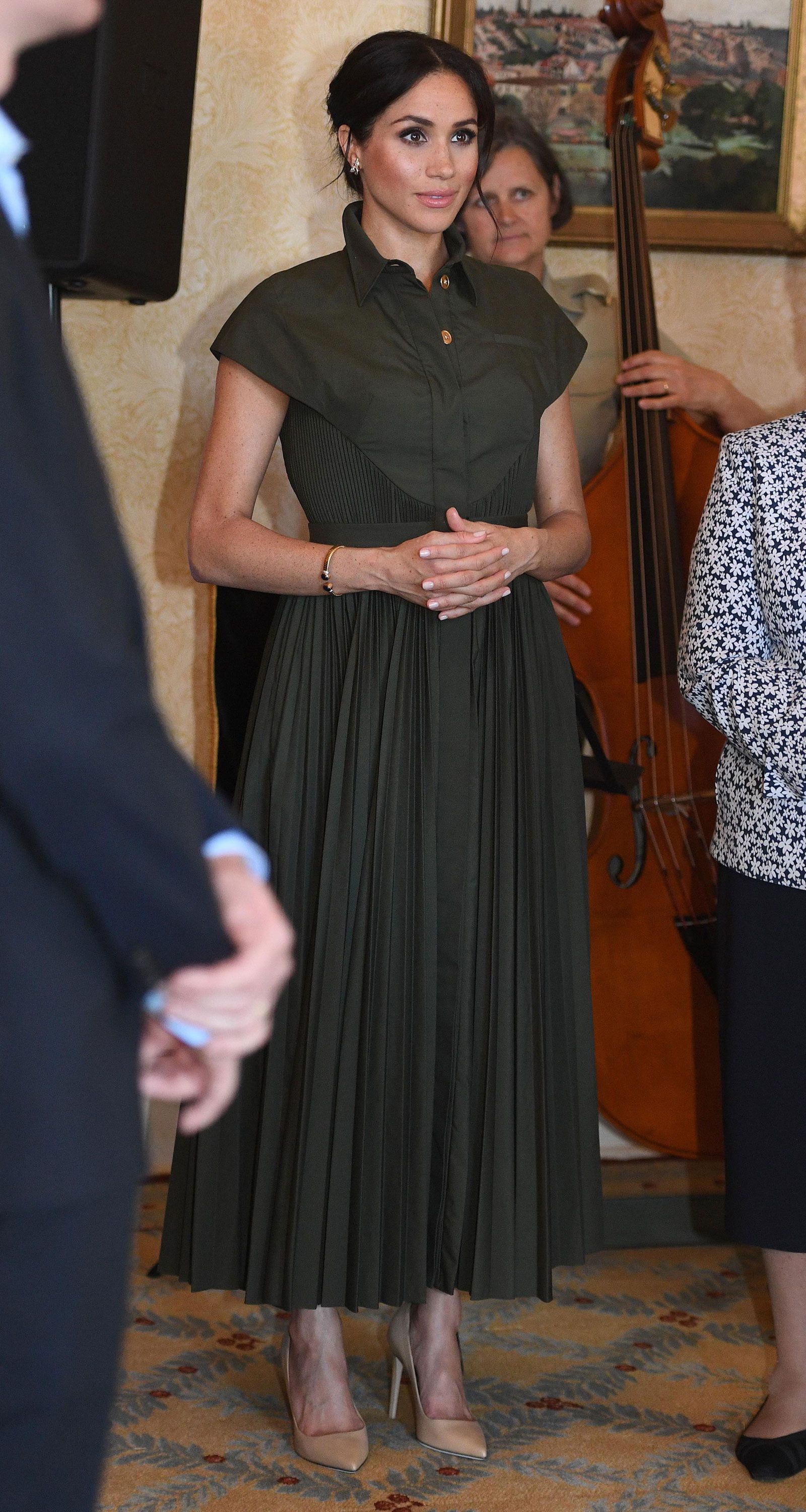 The Duchess of Sussex wears green dress ...