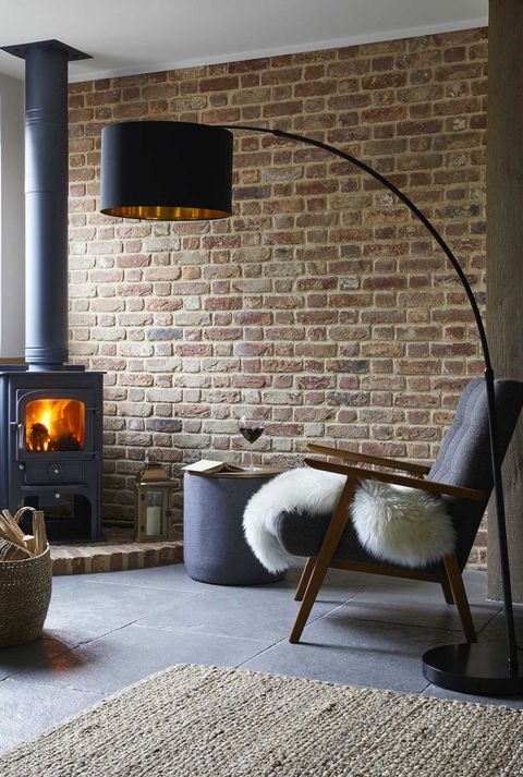 cosy winter living room setting with floor lamp and stove