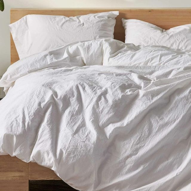 white coyuchi duvet cover on bed