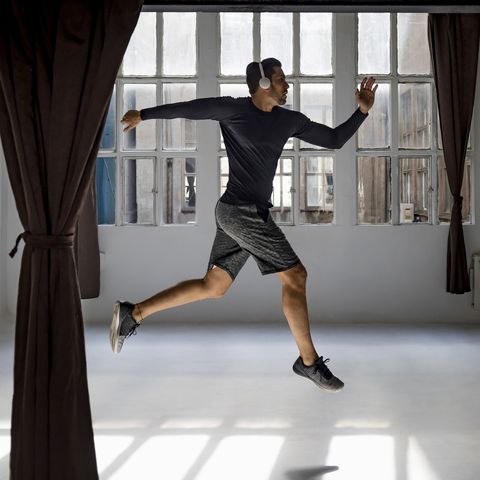dynamic athlete jumping in studio loft