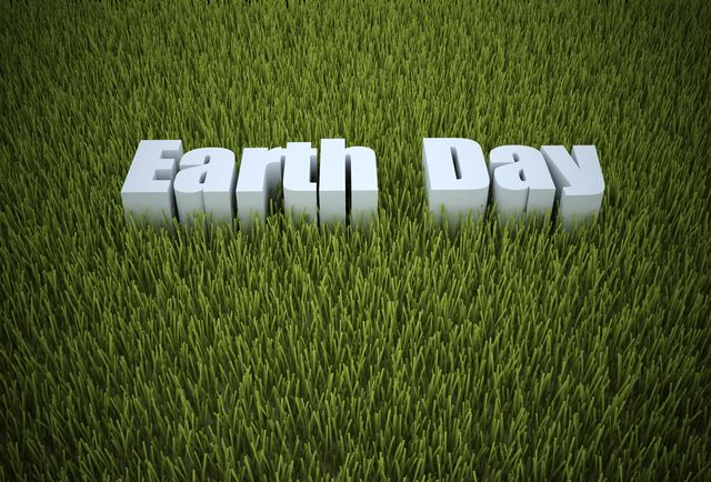 earth day written in green grass
