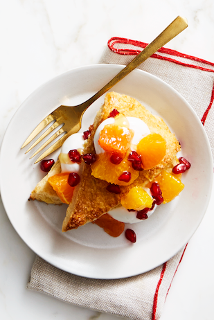 breakfast shortcakes with pomegranate seeds and cream on a plate