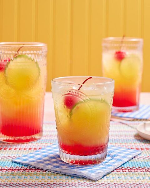 tequila sunrise with cherry in glass