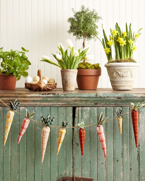 a garland made from carrots fashioned out of vintage orange and green fabrics