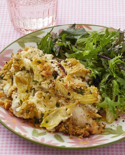 artichoke chicken on plate with side salad