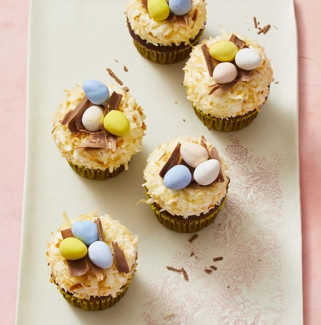 chocolate easter egg cupcakes with chocolate eggs on top in a nest