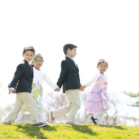 two girls and two boys dressed in easter outfits