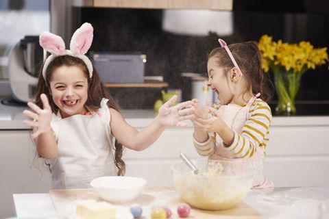 two girls baking and laughing