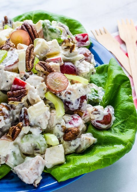 chicken waldorf salad on lettuce with wooden forks