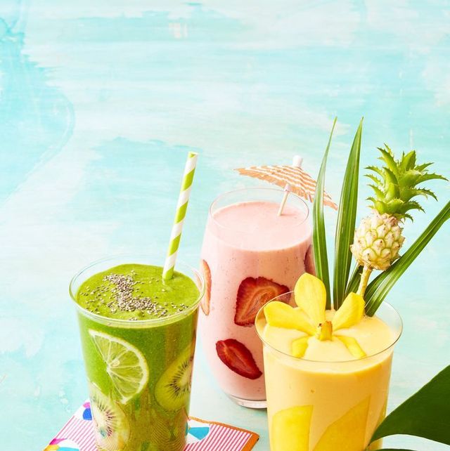 weight loss smoothies kiwi strawberry and pineapple smoothies on a blue surface