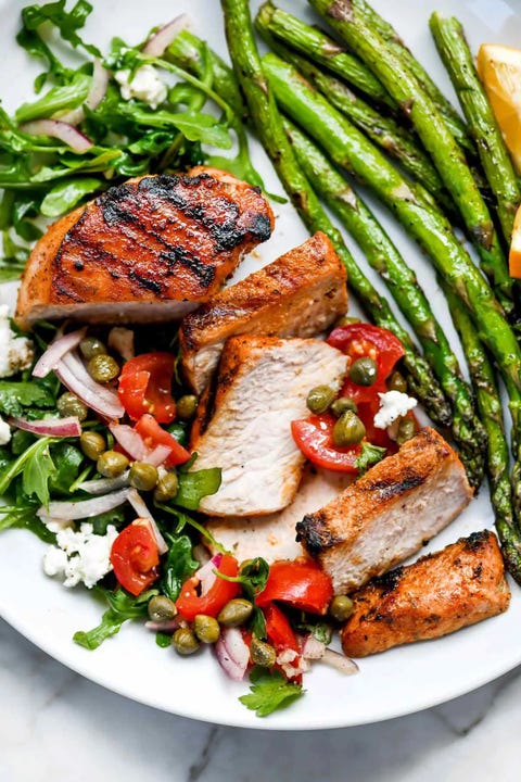 mediterranean grilled pork chops with tomatoes and asparagus