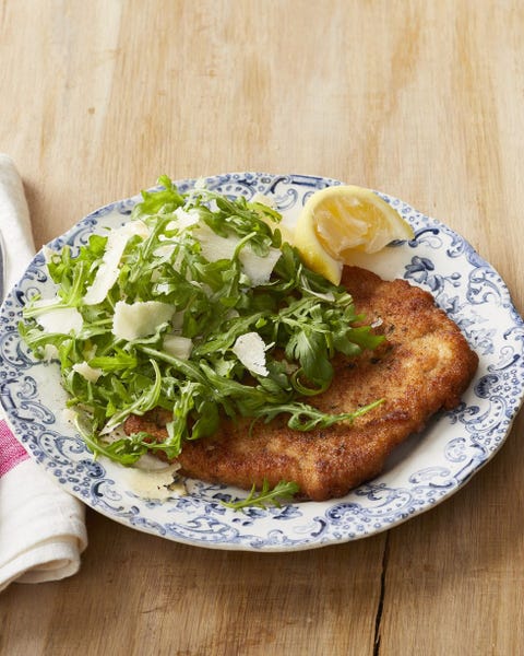 pork milanese with arugula salad on top