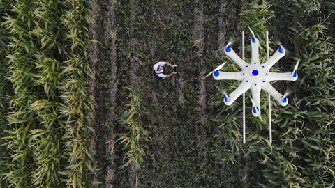 farmer spraying his crops using a drone