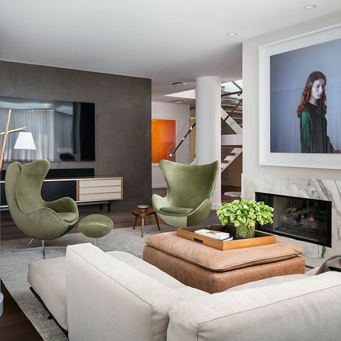 living room with green wing chairs