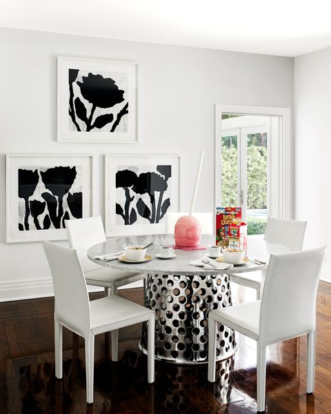 aman and meeks breakfast area with round white table with steel base