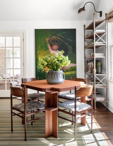 James Huniford - ELLE Decor james huniford study with games table and chairs and open rack shelves