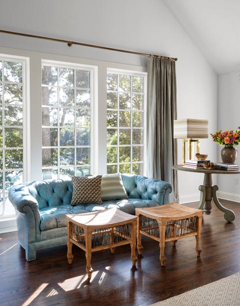 James Huniford - ELLE Decor james huniford sitting area with blue leather tufted sofa