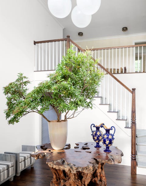 James Huniford - ELLE Decor james huniford rustic table in stairway hall