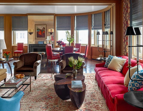 katie ridder round living room with sofas and artwork by robert deniro sr