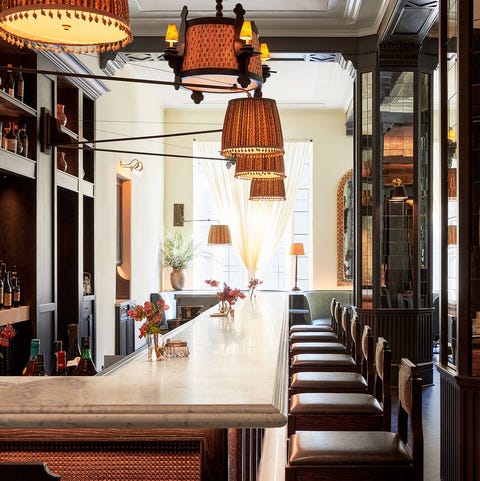 A List 2022 - ELLE DECOR long bar area with leather bar seats