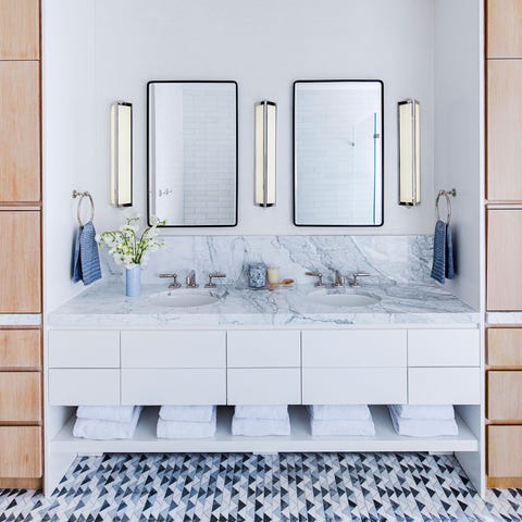 A List 2022 - ELLE DECOR bathroom with double sink and matching mirrors and marble topped vanity