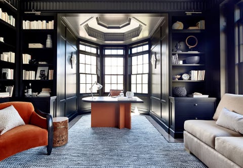 Toledo Geller Office office with dark walls and dome shape at the end containing three window
