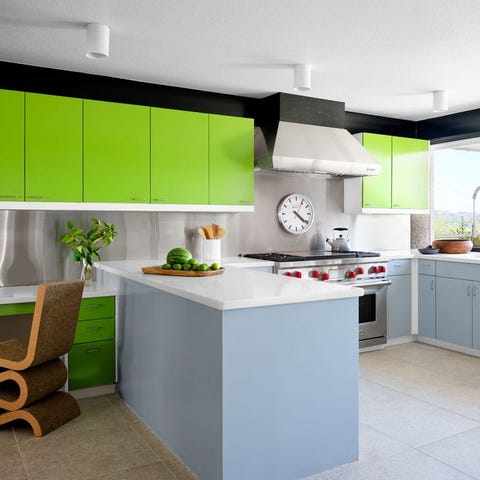A List 2022 - ELLE DECOR modern light blue counter kitchen with acid green cabinets