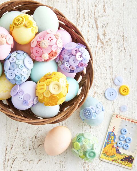 bowl of easter eggs decorated with buttons