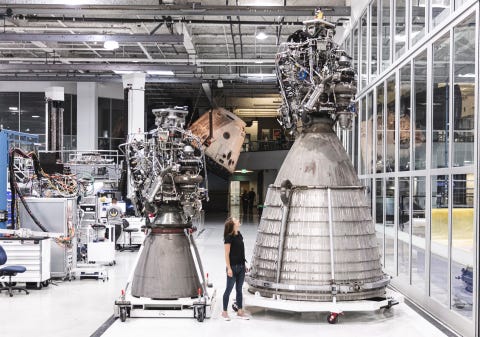 spacex's raptor vacuum engine next to a