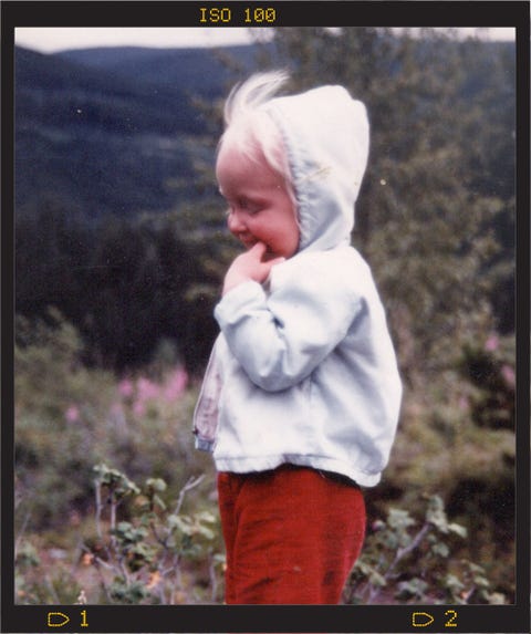 baby in red pants and white jacket