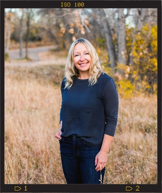 headshot of jamie in a field