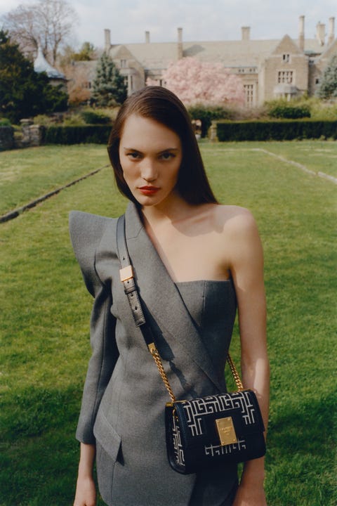 girl in balmain 1945 heritage bag in garden