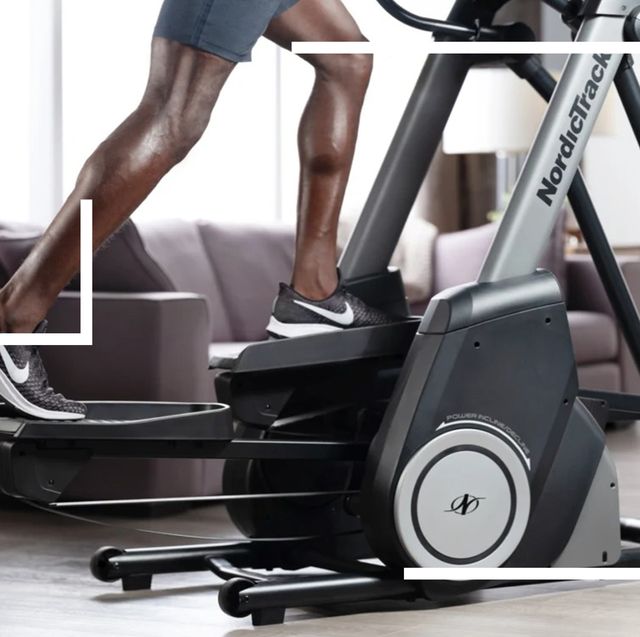 person using nordictrack elliptical machine in living room
